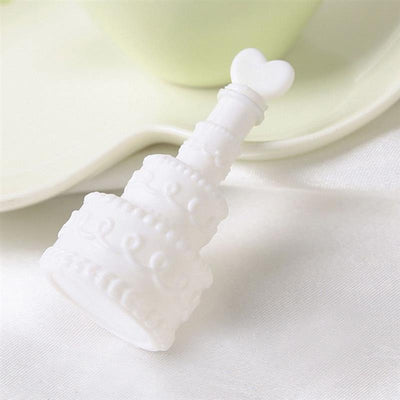 White silicone cake mold with heart-shaped handle