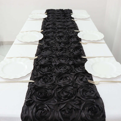 Black rose table runner with white plates arranged on a dining table.