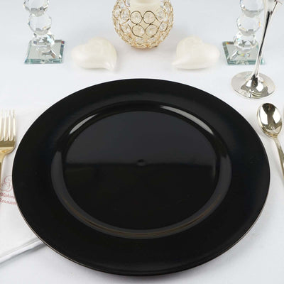 Black dinner plate on a white table setting with elegant decor.