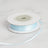 Light blue satin ribbon on a spool against a white background