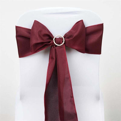 Burgundy chair sash with pearl embellishment for elegant decor