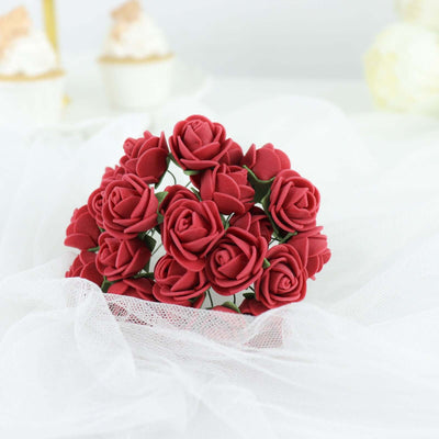 Red foam roses bouquet on a soft white fabric backdrop.