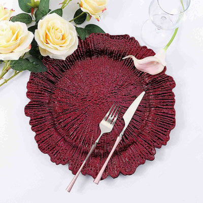 Red decorative plate with fork and knife, surrounded by flowers.
