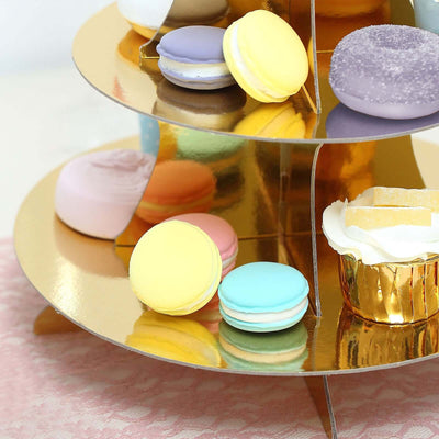Colorful macarons displayed on a gold tiered stand.