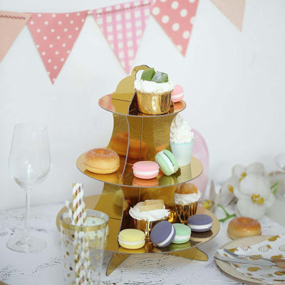 Gold tiered dessert stand with colorful pastries and sweets, set for a celebration.