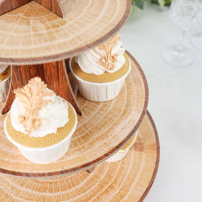 Cupcakes on a decorative tiered stand with intricate frosting.