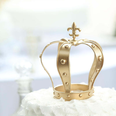 Gold decorative crown on a white floral base.