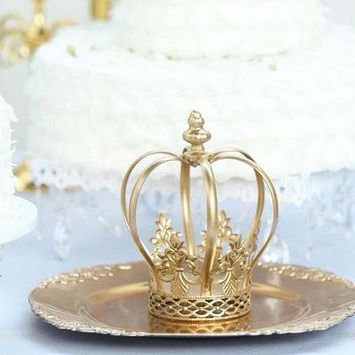 Gold crown on a silver platter, elegantly displayed for a celebration.