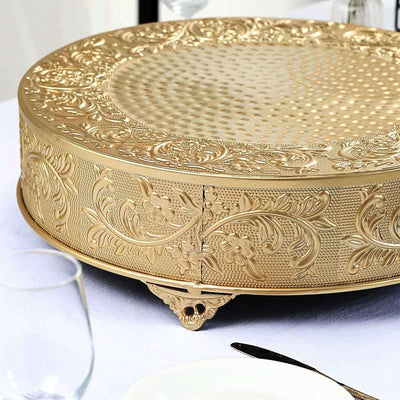Decorative gold serving tray with intricate engravings and detailed patterns.