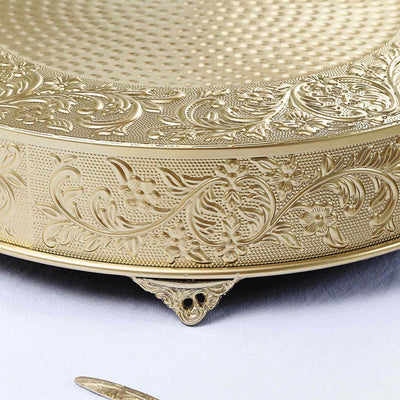 Decorative gold serving platter with intricate floral engravings.
