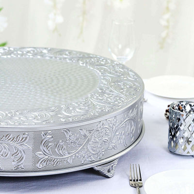 Elegant silver serving platter with intricate floral design.