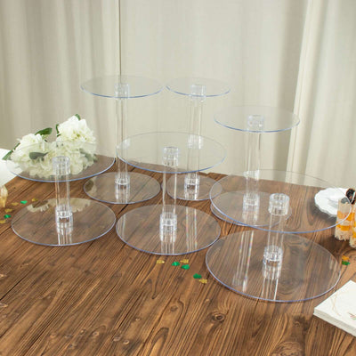 Clear acrylic display risers in various heights on a wooden table.