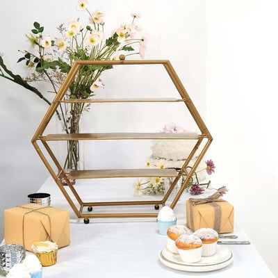 Hexagon-shaped gold display shelf with decorative flowers and treats.