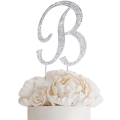Glittery silver letter "B" cake topper with white flower accents