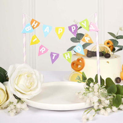 Colorful "Happy Birthday" banner with floral decorations on a white plate.