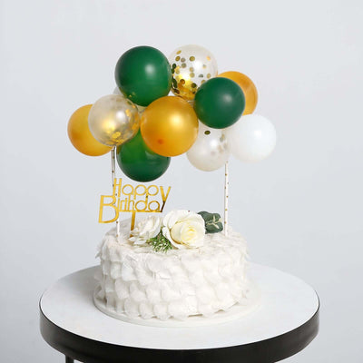 Birthday cake with balloons and decorations on a table.