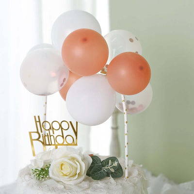Birthday balloons and decor with a "Happy Birthday" sign.