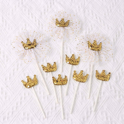 Gold crown cake toppers with tulle and sequins for festive celebrations.