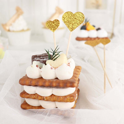 Decorative dessert with whipped cream, cookies, and heart-shaped toppers.