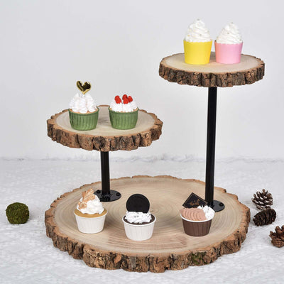 Three-tiered wooden cupcake display stand with assorted decorative cupcakes.