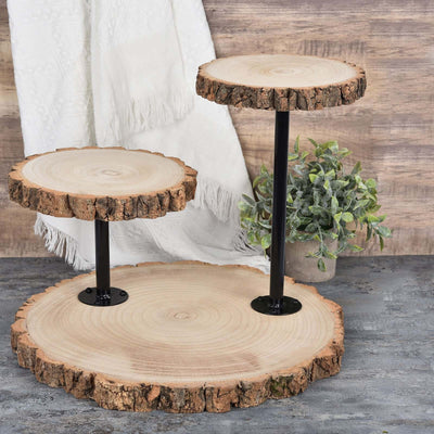 Rustic wooden cake stand with three tiers and black metal supports.