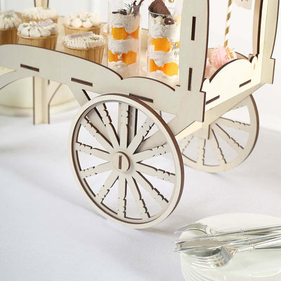 Wooden dessert cart with decorative wheels showcasing assorted treats.