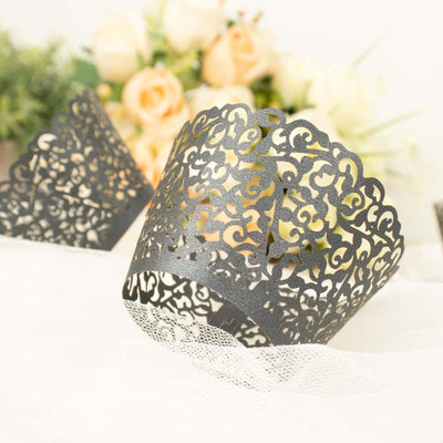 Black lace cupcake wrappers with intricate designs