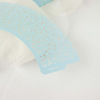 Blue lace paper doily with intricate floral design.