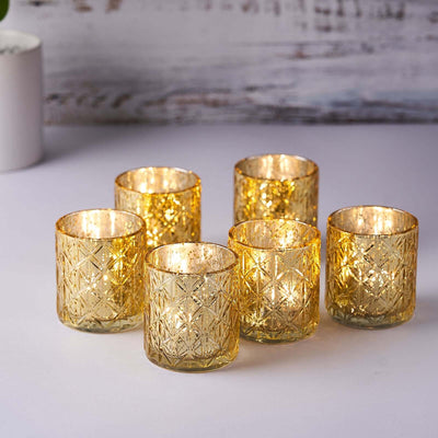 Set of six decorative gold candle holders