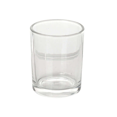 Clear glass shot glass on a white background
