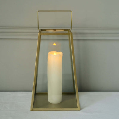 Glass lantern with a candle, warm glow, elegant design.