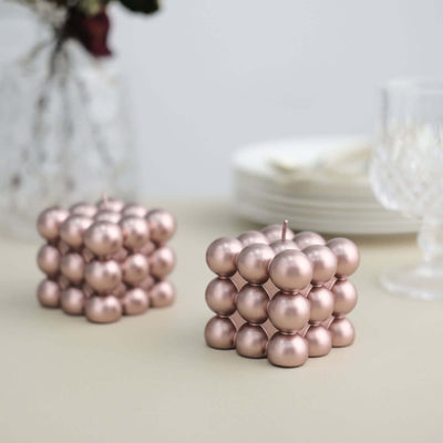 Decorative metallic ball candles in a modern design.