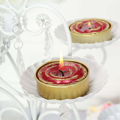 Decorative spiral candles with gold accents on a candelabra.