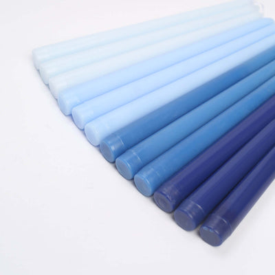 Blue gradient candles in varying shades from light to dark