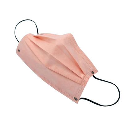 Peach disposable face mask on a white background