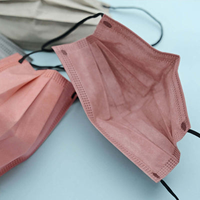 Assorted disposable face masks in various colors.