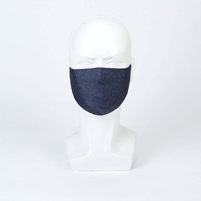 Navy blue fabric face mask on a mannequin head