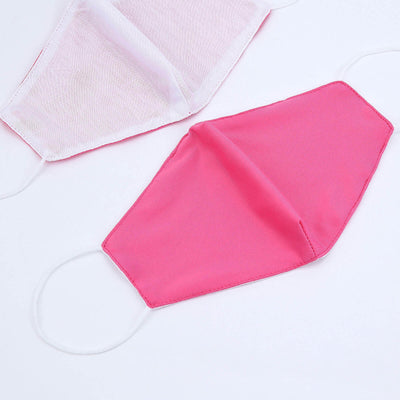Pink fabric face mask on white background