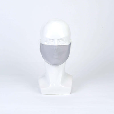 Gray face mask displayed on a white mannequin head