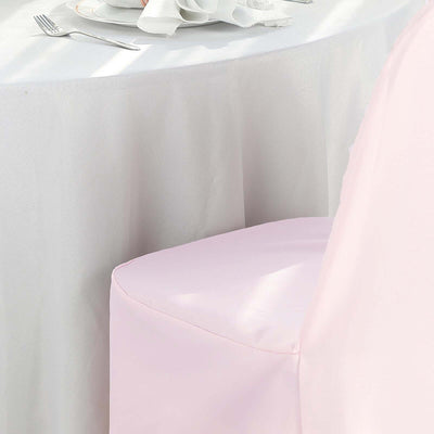 Pink chair cover on a table with a white tablecloth.