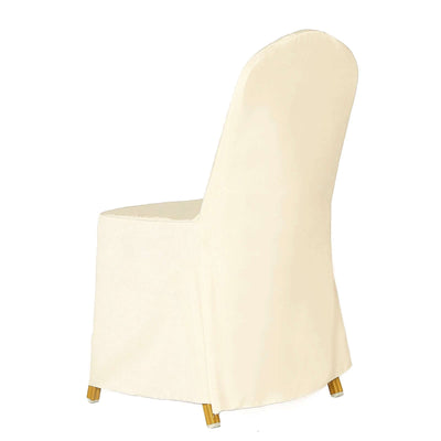 Cream upholstered chair with gold legs, studio-style isolation shot.