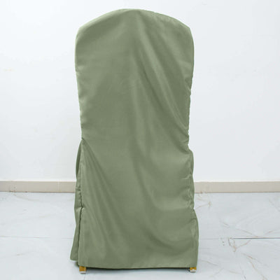 Green chair cover on a plain backdrop.
