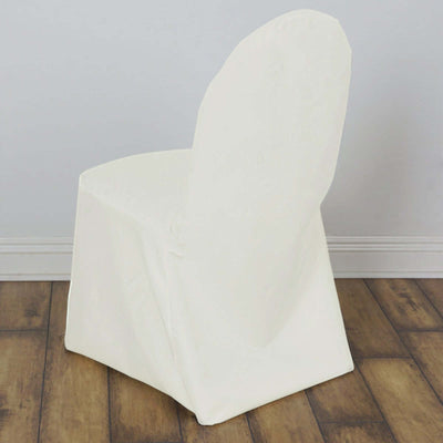 White chair cover draped over a chair against a plain background