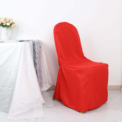 Red chair cover on a dining chair in a staged setting.