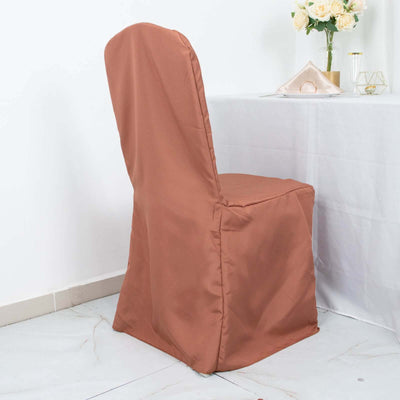 Brown chair cover draped over a chair in a dining setting.