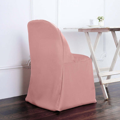Pink chair cover displayed on a wooden chair near a table.