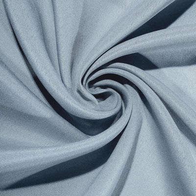 Light blue fabric texture in a swirling pattern.