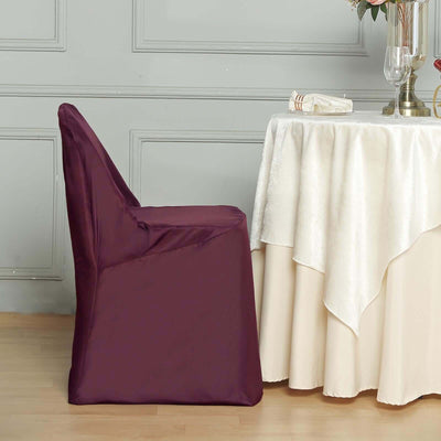 Purple chair cover on a dining chair by a table.