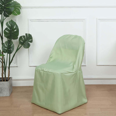 Green chair cover draped over a chair in a stylish interior setting.