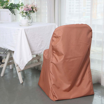 Brown chair cover draped on a chair beside a table with flowers